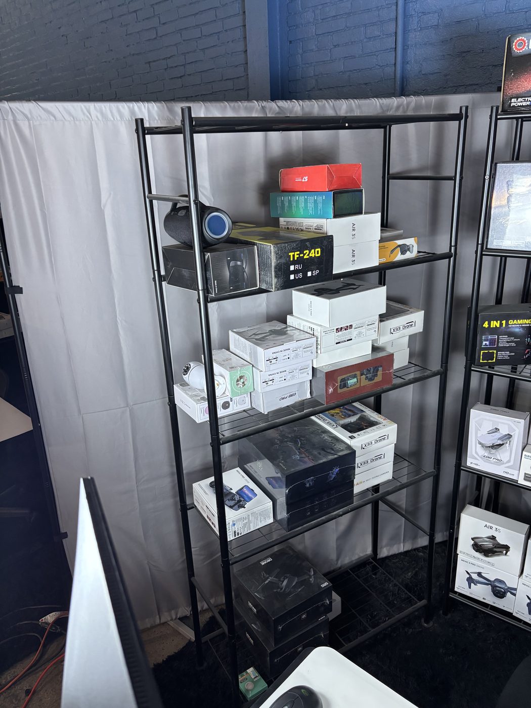 Display rack keeping product organized and within reach for grab-and-run on stream